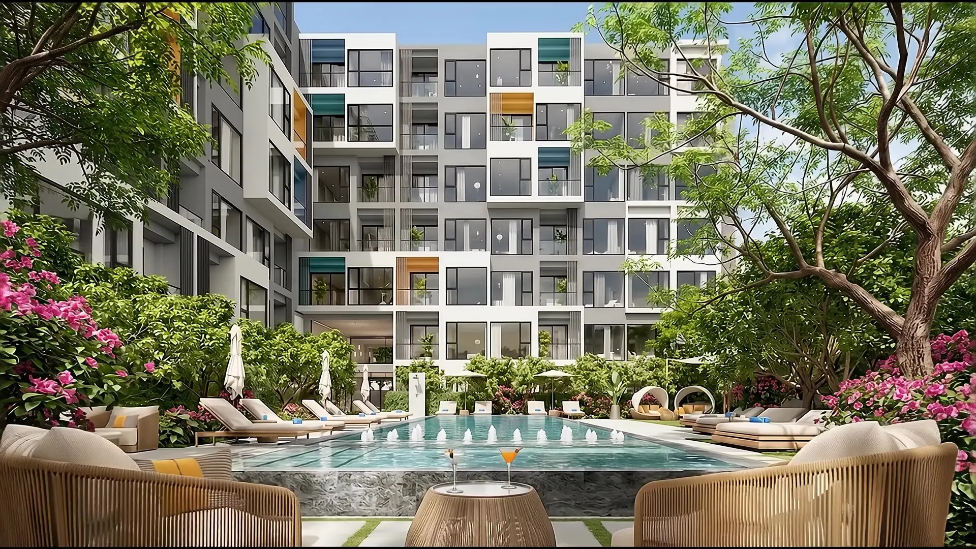 A pool courtyard in a tropical garden in front of a white and grey modular condominium